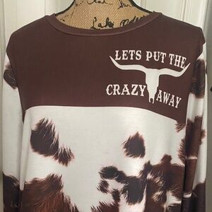 Yellowstone "Lets Put the Crazy Away" Sweatshirt. M. Brown and White Cow Print.